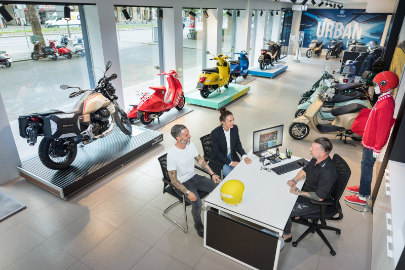 Sales area in a Faber store, with vehicles and driver equipment in the background