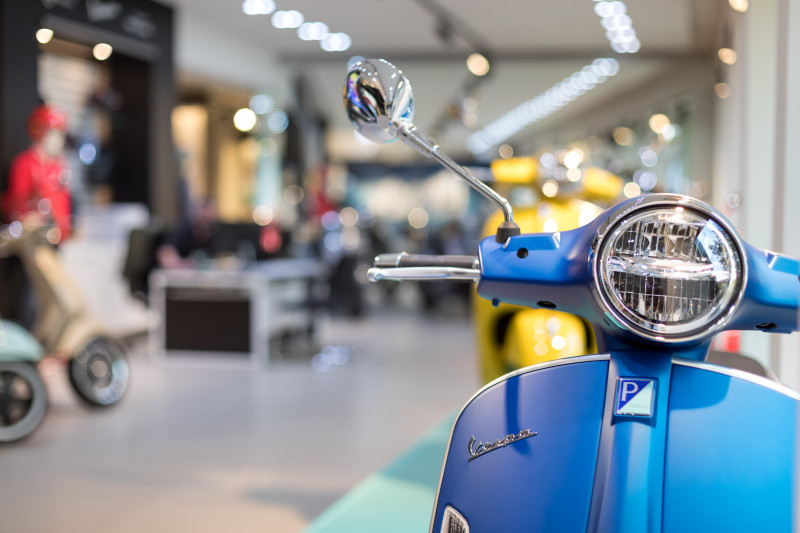 Close-up of a Vespa in a Faber showroom